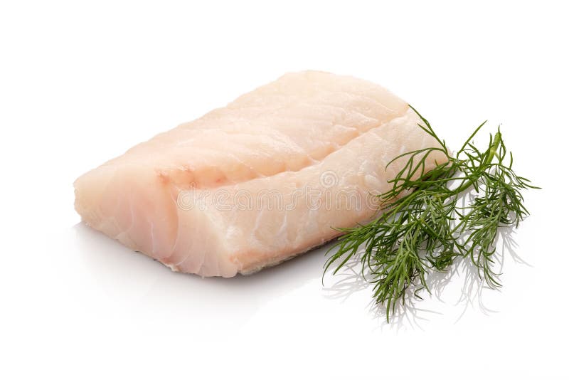 Rå torskfiskfilet med grön dill royaltyfria bilder Rå torskfiskfilet med grön dill royaltyfria bilder