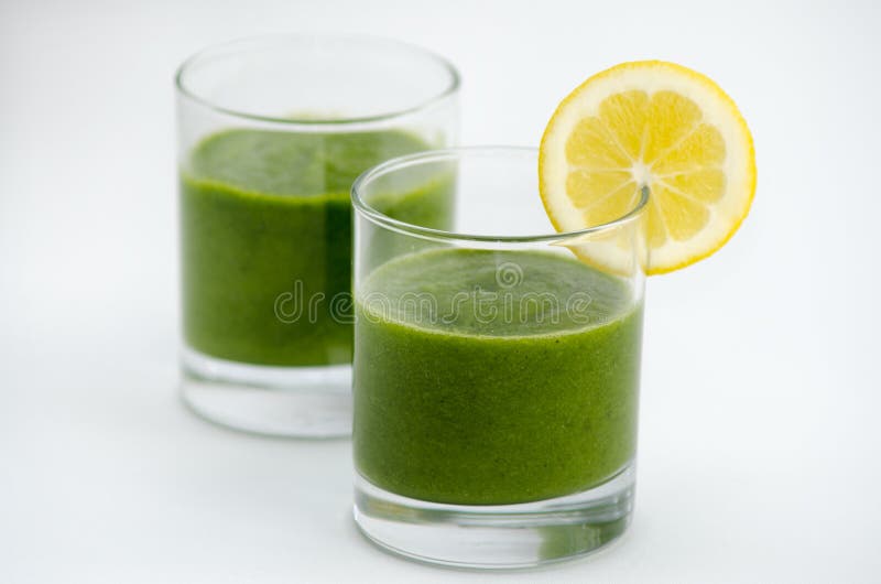 Green smoothie alkaline diet drink with fresh lemon. Green smoothie alkaline diet drink with fresh lemon.