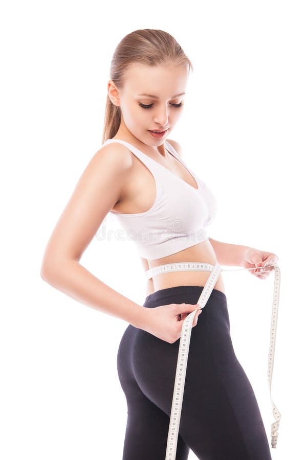 Régime de la cuisse de mesure de femme avec la bande images stock Régime de la cuisse de mesure de femme avec la bande images stock