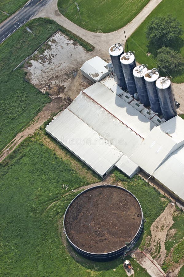 Example of a manure tank on a dairy farm. Cows and cattle poop just like anything else and on dairy farms the manure is stored in tanks and used as fertilizer in the fields. Animal waste is regulated by the government so it is an issue for farmers and the agriculture business. Example of a manure tank on a dairy farm. Cows and cattle poop just like anything else and on dairy farms the manure is stored in tanks and used as fertilizer in the fields. Animal waste is regulated by the government so it is an issue for farmers and the agriculture business.