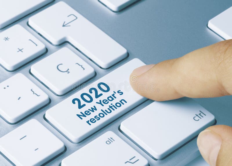 2020 New Year`s resolution Written on Red Key of Metallic Keyboard. Finger pressing key. 2020 New Year`s resolution Written on Red Key of Metallic Keyboard. Finger pressing key