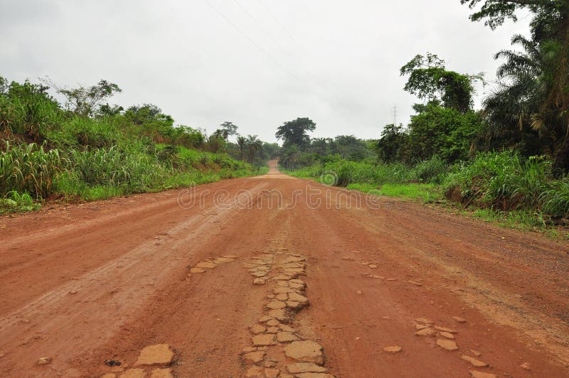 Red African endless road through the jungle. Red African endless road through the jungle