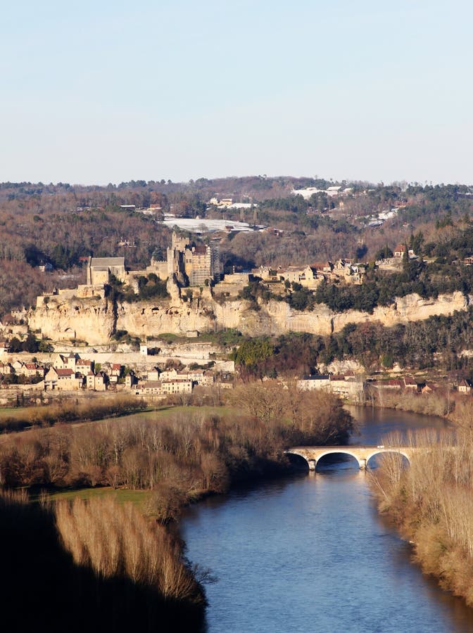 Dordogne River with the French Castle Beynac in the background located in Perigord, Aquitaine, France. Dordogne River with the French Castle Beynac in the background located in Perigord, Aquitaine, France.