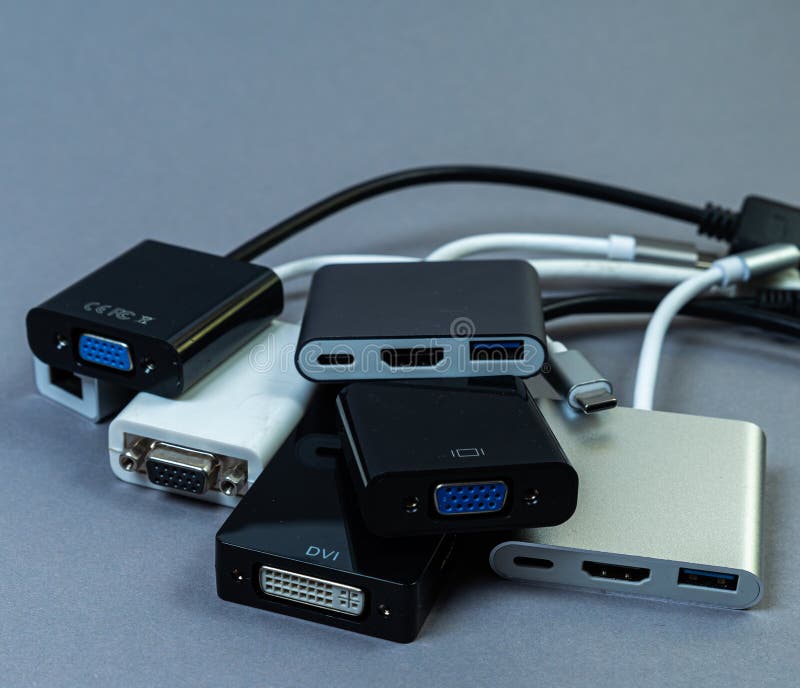 USB Type C adapter or hub with various accessories - pendrives, hdmi, ethernet, memory card, cables. Hands holding various converter cables for computers and smartphones. USB Type C adapter or hub with various accessories - pendrives, hdmi, ethernet, memory card, cables. Hands holding various converter cables for computers and smartphones