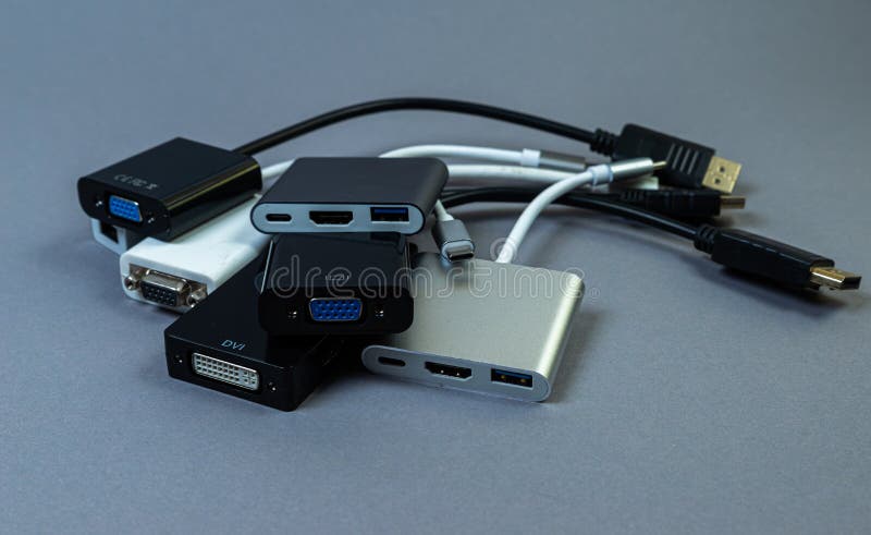 USB Type C adapter or hub with various accessories - pendrives, hdmi, ethernet, memory card, cables. Hands holding various converter cables for computers and smartphones. USB Type C adapter or hub with various accessories - pendrives, hdmi, ethernet, memory card, cables. Hands holding various converter cables for computers and smartphones