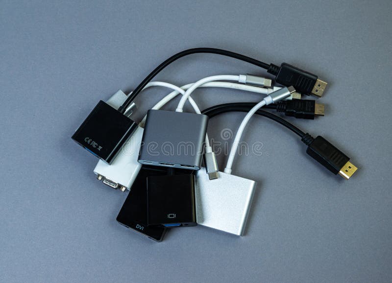 USB Type C adapter or hub with various accessories - pendrives, hdmi, ethernet, memory card, cables. Hands holding various converter cables for computers and smartphones. USB Type C adapter or hub with various accessories - pendrives, hdmi, ethernet, memory card, cables. Hands holding various converter cables for computers and smartphones