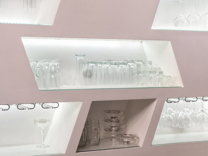 Pink wall with niches for glasses in the bar. Pink wall with niches for glasses in the bar.