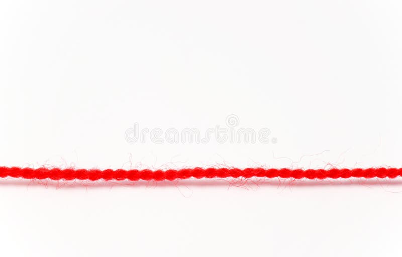 A red thread or rope isolated on white. A red thread or rope isolated on white.