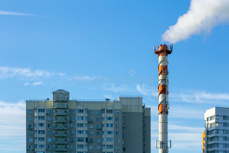 Smoke pollution. Smoke pipes against the blue sky. Smoke pollution. Smoke pipes against the blue sky.