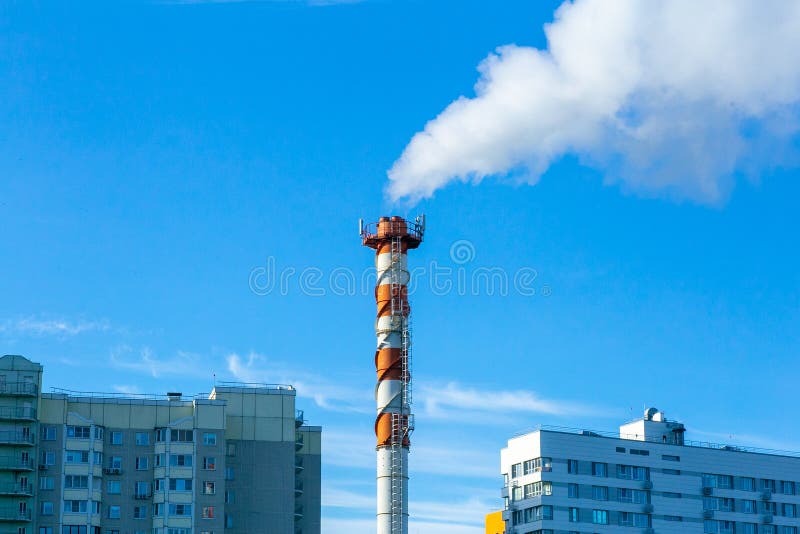 Smoke pollution. Smoke pipes against the blue sky. Smoke pollution. Smoke pipes against the blue sky.