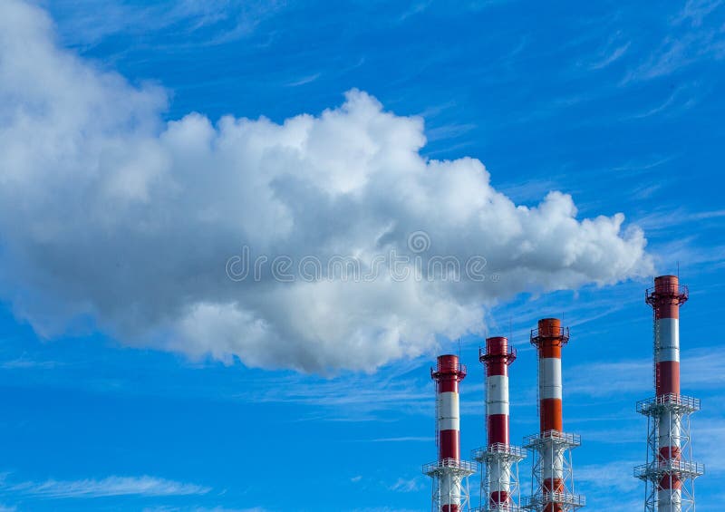 Smoke pollution. Smoke pipes against the blue sky. Smoke pollution. Smoke pipes against the blue sky.