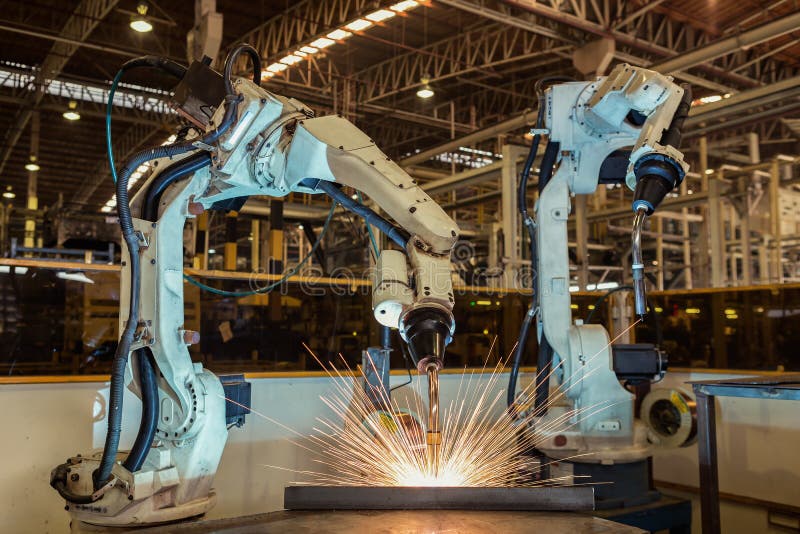 Rörelse av robotsvetsning i fabrik royaltyfri foto Rörelse av robotsvetsning i fabrik royaltyfri foto