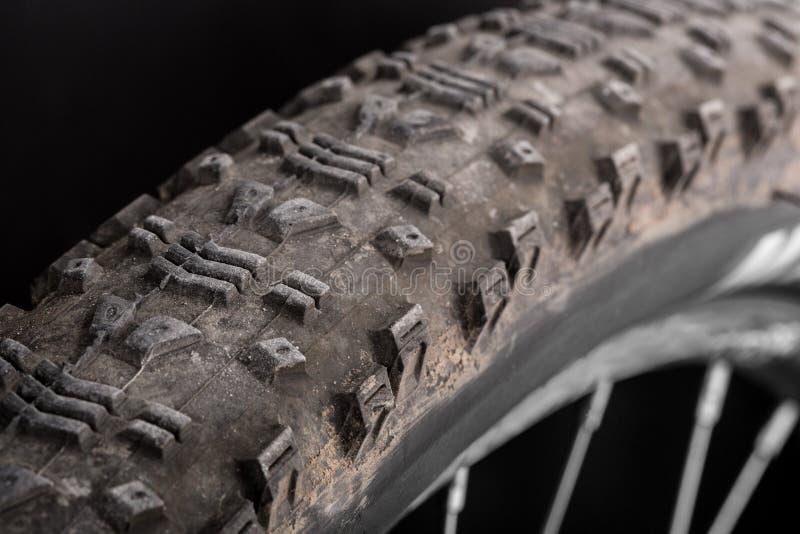 Muddy tire of a mountain bicycle. Muddy tire of a mountain bicycle