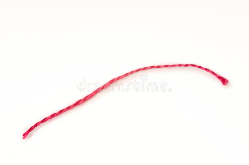 Single red thread with white background. Single red thread with white background