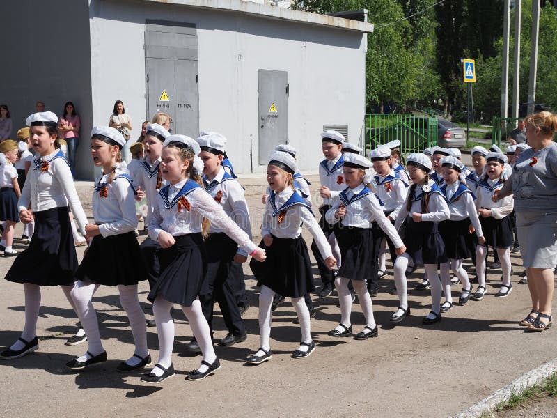 Russia, the city of Saratov May 9, 2021: Festive parade of the 76th anniversary of the Great Victory, the youngest participants are groups of schoolchildren in military uniform. Russia, the city of Saratov May 9, 2021: Festive parade of the 76th anniversary of the Great Victory, the youngest participants are groups of schoolchildren in military uniform.