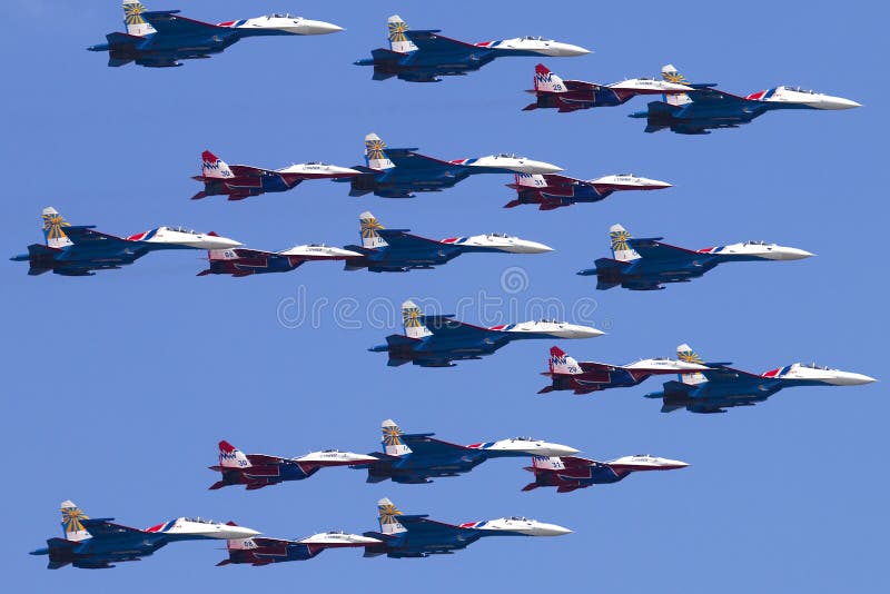 Russia, Moscow, Victory Day May 9, 2016 - manned team Swifts and Russian Knights in the pure blue sky. Russia, Moscow, Victory Day May 9, 2016 - manned team Swifts and Russian Knights in the pure blue sky.