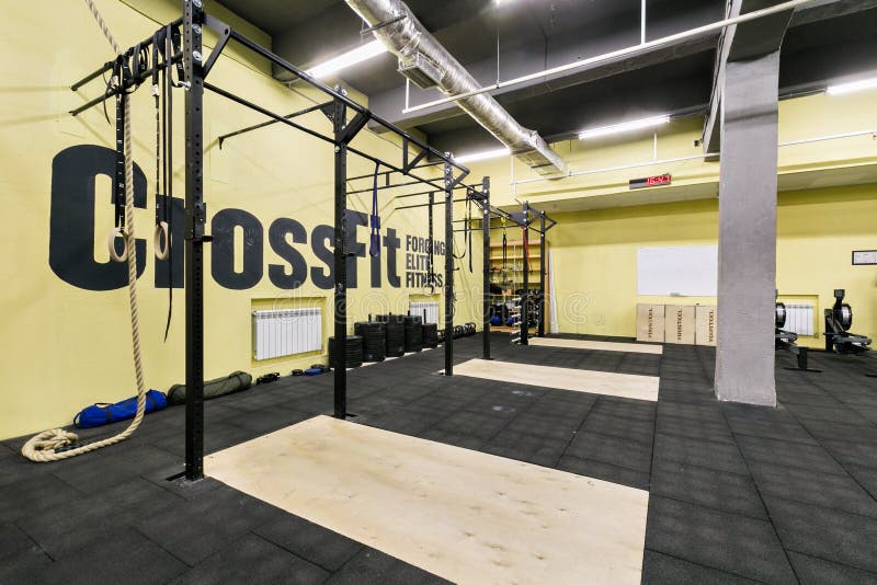 Russia, Nizhny Novgorod - January 30, 2017: Interior of the gym for fitness workout. Cross fit training. Barbells kettlebells bars and weightlifting gear. Russia, Nizhny Novgorod - January 30, 2017: Interior of the gym for fitness workout. Cross fit training. Barbells kettlebells bars and weightlifting gear.