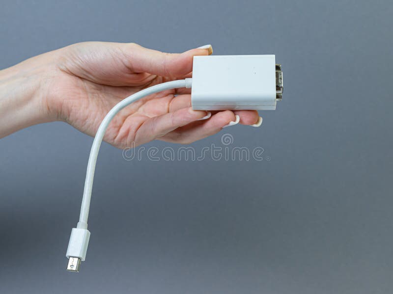 USB Type C adapter or hub with various accessories - pendrives, hdmi, ethernet, memory card, cables. Hands holding various converter cables for computers and smartphones. USB Type C adapter or hub with various accessories - pendrives, hdmi, ethernet, memory card, cables. Hands holding various converter cables for computers and smartphones