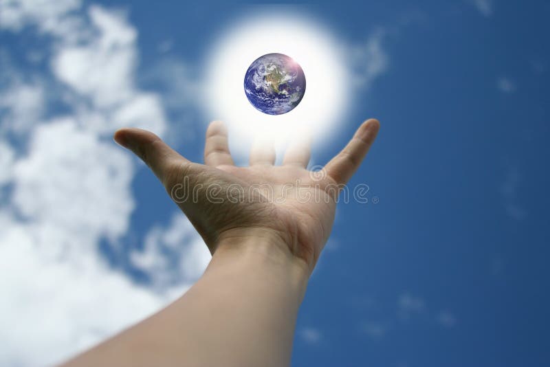 Outreached hand with a glowing earth floating above. Outreached hand with a glowing earth floating above.