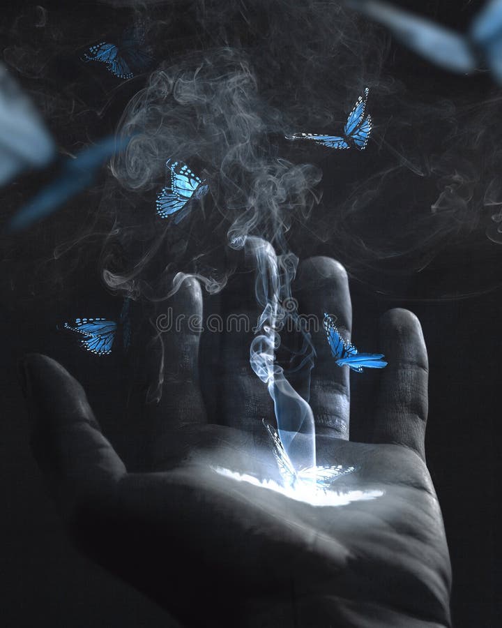 Blue butterflies flying out of a glowing hand. Blue butterflies flying out of a glowing hand