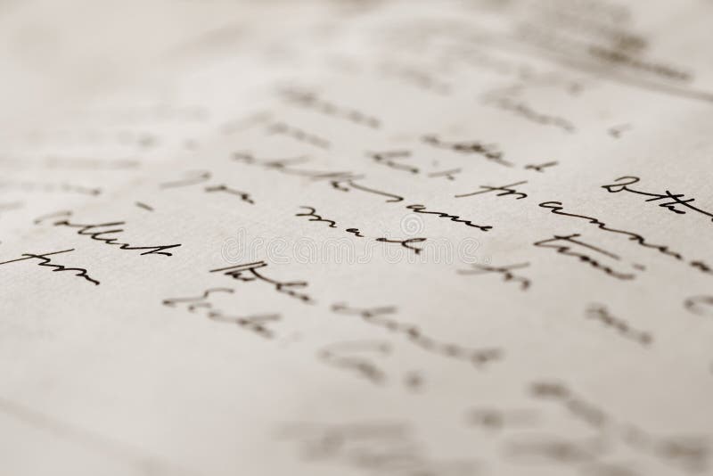 A close up with a narrow depth of field of a hand-written letter. A close up with a narrow depth of field of a hand-written letter