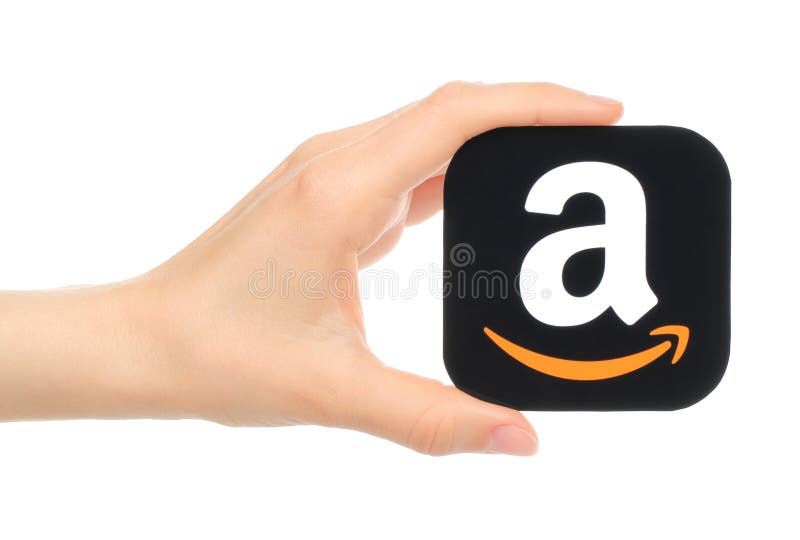 Ręka trzyma amazonki ikonę drukuje na papierze obrazy stock Ręka trzyma amazonki ikonę drukuje na papierze obrazy stock