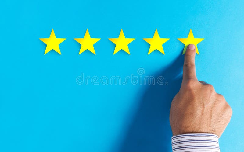 Hand choosing 5 stars rating on blue background - Positive feedback concept. Hand choosing 5 stars rating on blue background - Positive feedback concept