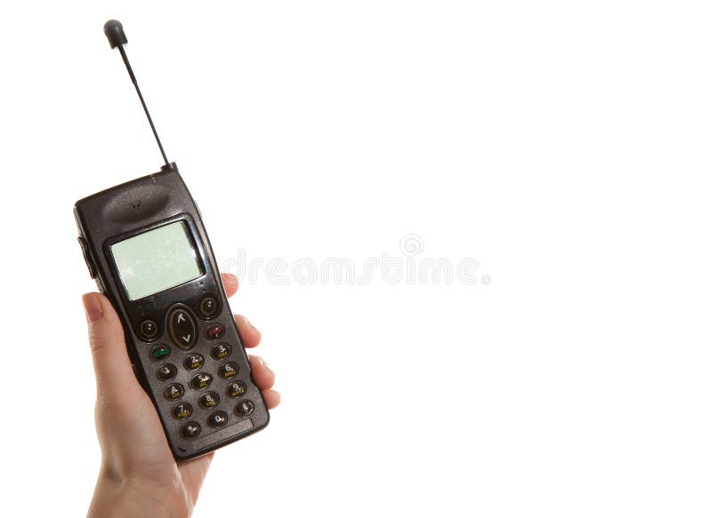 Ręki dziewczyna trzyma starego telefon komórkowego obrazy stock Ręki dziewczyna trzyma starego telefon komórkowego obrazy stock