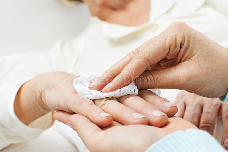 Hands helping with personal hygiene for senior woman. Hands helping with personal hygiene for senior woman