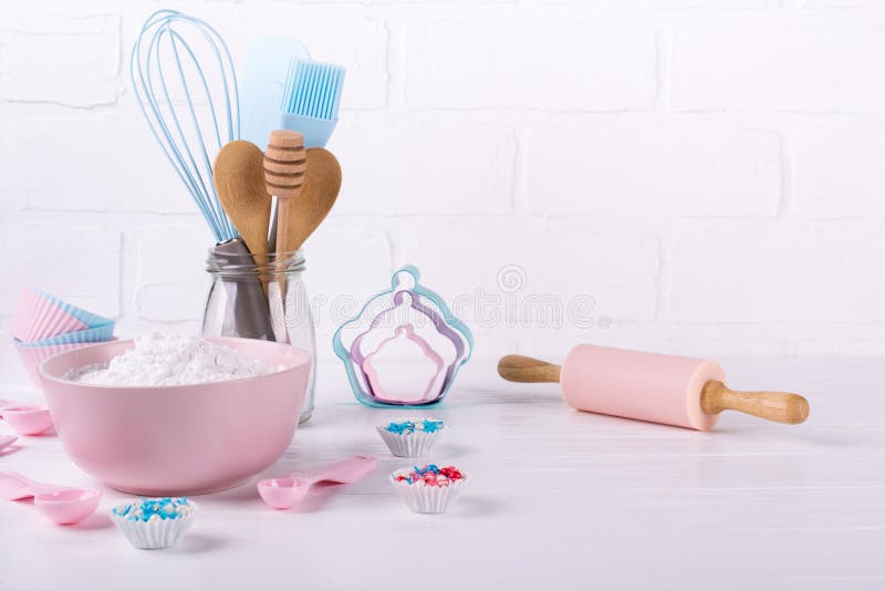It`s cooking time. Baking tools on white table. Recipe book background concept.