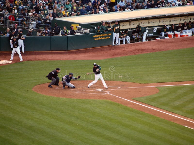 Yankees 6 vs A's 2: A's Kevin Kouzmanoff swings at an incoming pitch with Francisco Cervelli catching. July 7 2010 at the Coliseum in Oakland California