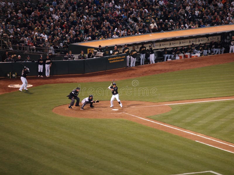 Yankees 6 vs A's 2: A's Kurt Suzuki up to bat with banded aid under his chin from a ball that bounced off his face earlier in the night. Taken July 7 2010 at the Coliseum in Oakland California. Yankees 6 vs A's 2: A's Kurt Suzuki up to bat with banded aid under his chin from a ball that bounced off his face earlier in the night. Taken July 7 2010 at the Coliseum in Oakland California