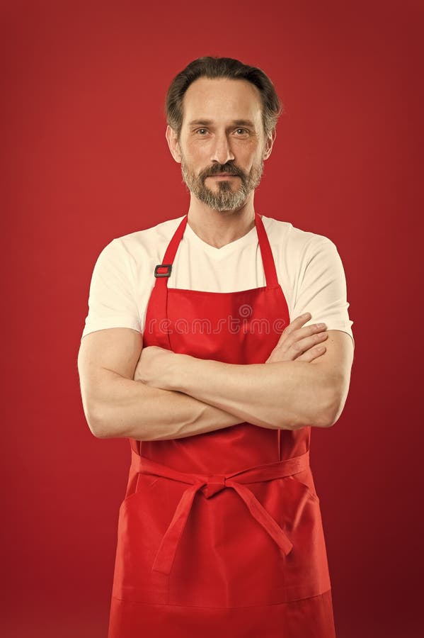 Confident In His Culinary Craft Cook With Beard And Mustache Wearing Apron Red Background Man 