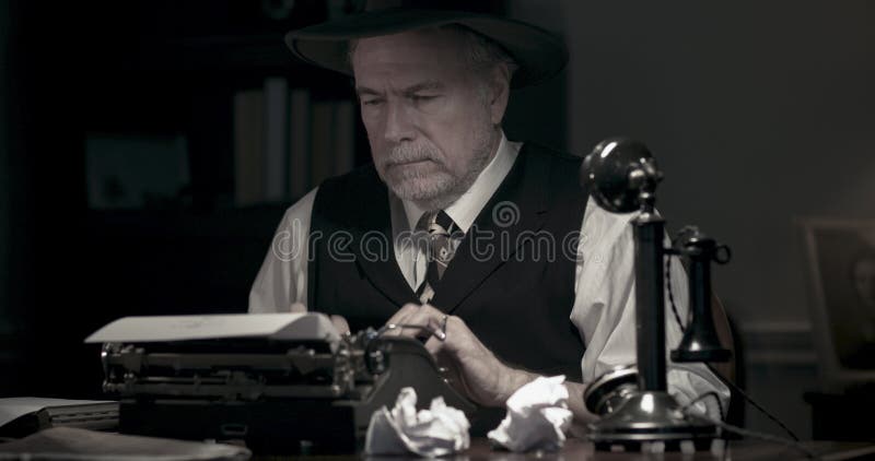 1940s Writer At His Desk Trying To Finish His Book Stock Photo
