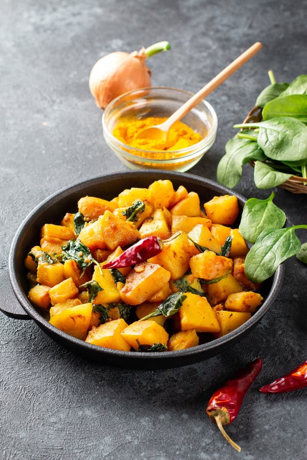 Saag Aloo, Indian Style Spinach and Potatoes in Cast Iron Pan Stock