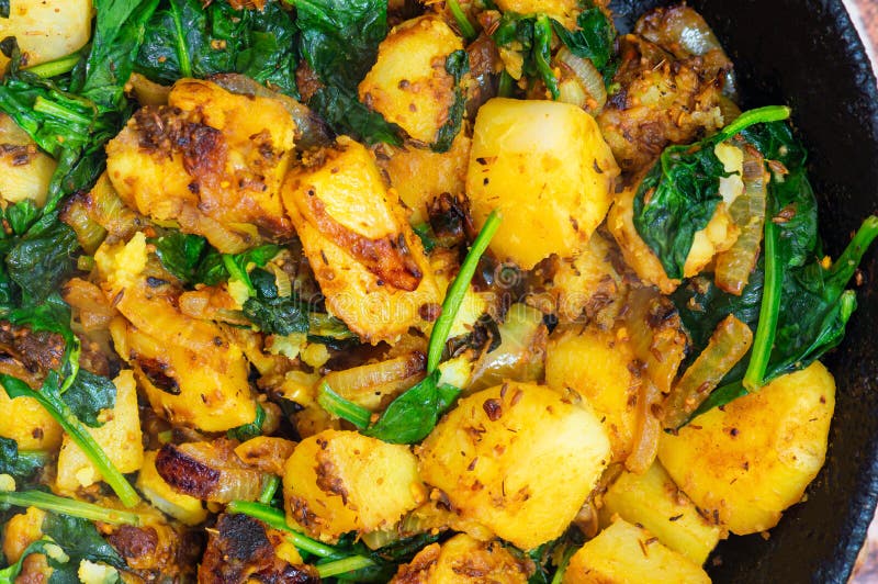 Saag Aloo, Indian Style Spinach and Potatoes in Cast Iron Pan Stock