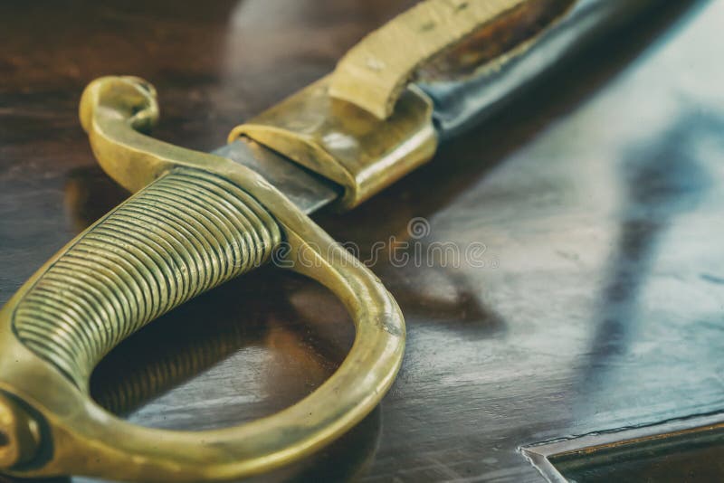 Saber with old handle shabby ribbed close-up weapon pirate privateer royalty free stock photography Saber with old handle shabby ribbed close-up weapon pirate privateer royalty free stock photography