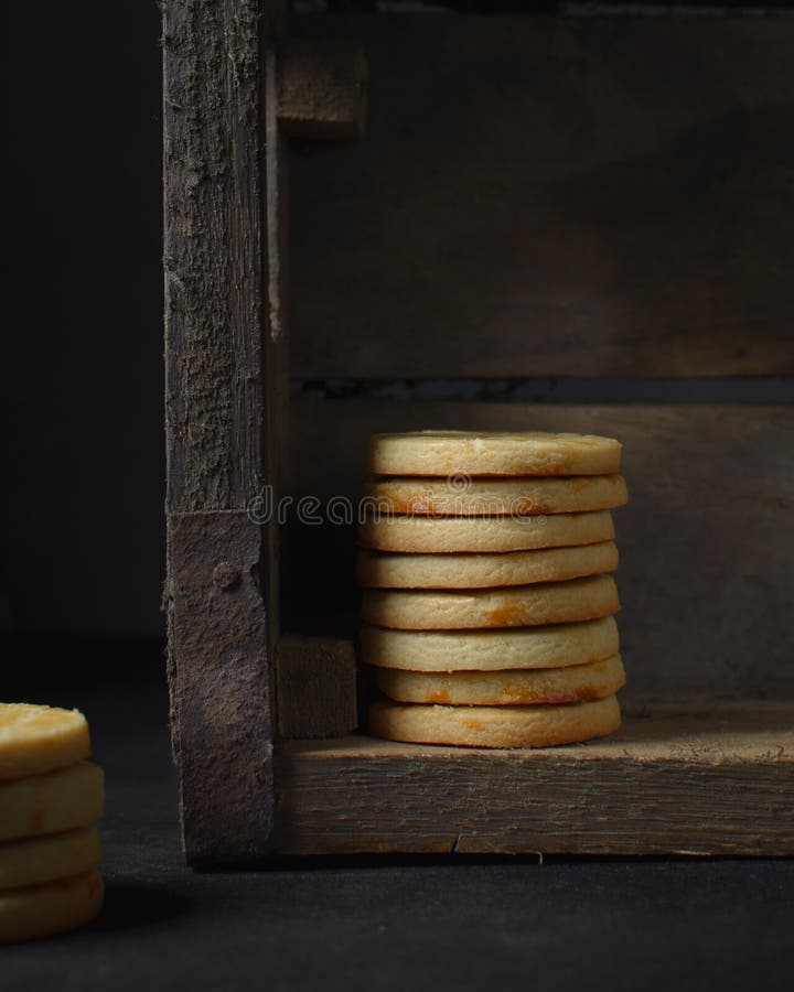 Sable Breton biscuits stacked in a wood box