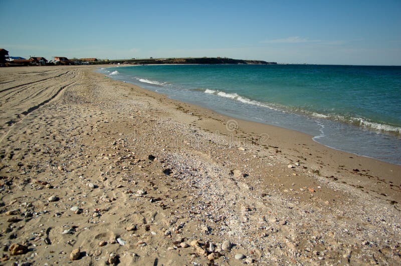 Sable vide de plage de côté de mer photos stock Sable vide de plage de côté de mer photos stock