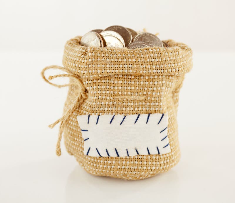 Sac complètement de pièces de monnaie photographie stock Sac complètement de pièces de monnaie photographie stock