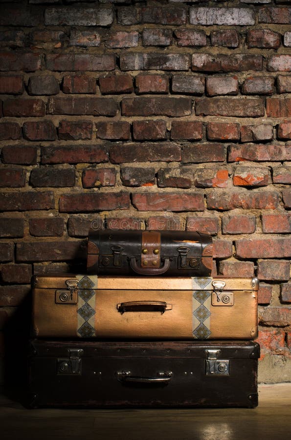 Three retro bags on old brick wall background. Three retro bags on old brick wall background