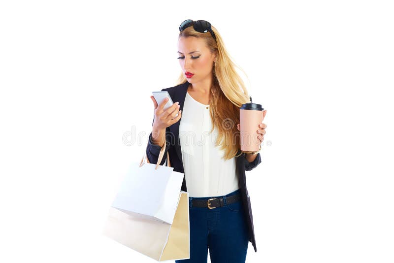 Sacs et smartphone shopaholic blonds de femme photographie stock libre de droits Sacs et smartphone shopaholic blonds de femme photographie stock libre de droits