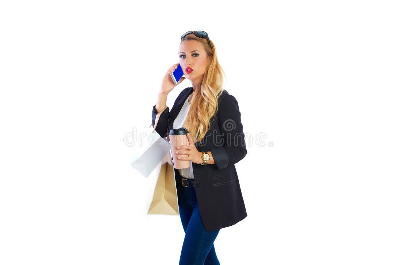 Sacs et smartphone shopaholic blonds de femme photo stock Sacs et smartphone shopaholic blonds de femme photo stock