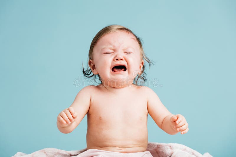 Sad baby sitting down and crying. stock photography Sad baby sitting down and crying. stock photography