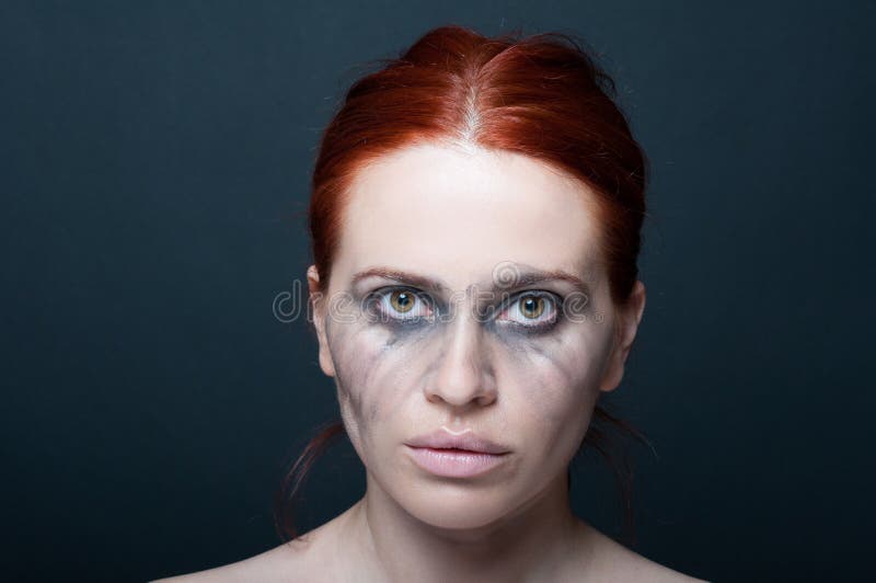 Sad beautiful woman with smudged make-up royalty free stock photography Sad beautiful woman with smudged make-up royalty free stock photography