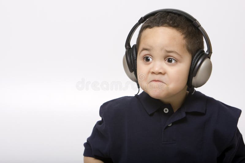 Sad boy with headphones stock image. Image of frowning 4451995