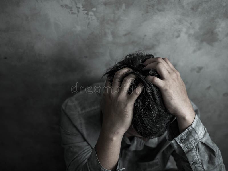 Sad businessman sitting head in hands in the dark bedroom with low light environment, dramatic concept, vintage color tone stock photo Sad businessman sitting head in hands in the dark bedroom with low light environment, dramatic concept, vintage color tone stock photo