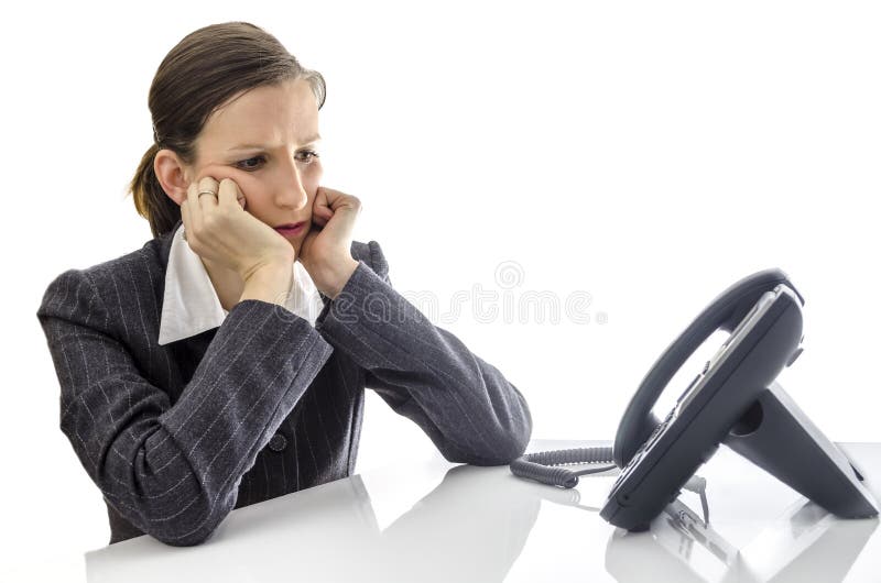 Sad businesswoman waiting for a phone call stock image
