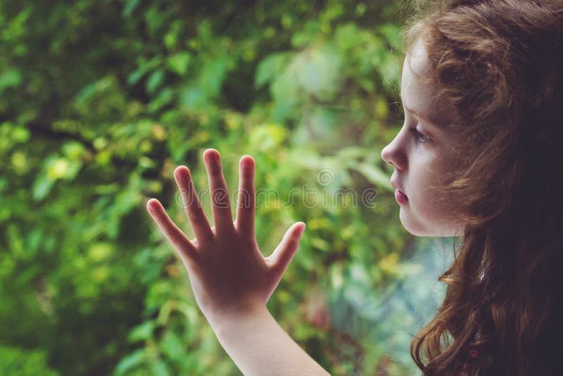 Sad child looking out the window. royalty free stock photo Sad child looking out the window. royalty free stock photo