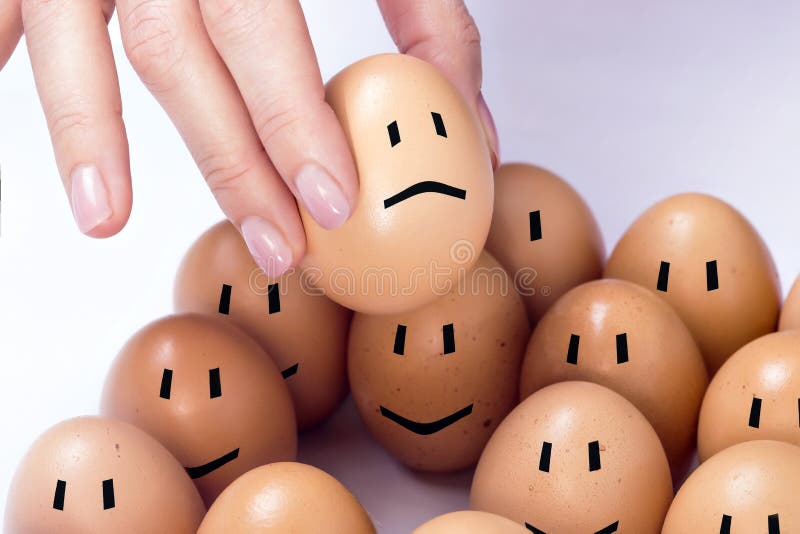 An egg selected among others, feeling sad. An egg selected among others, feeling sad